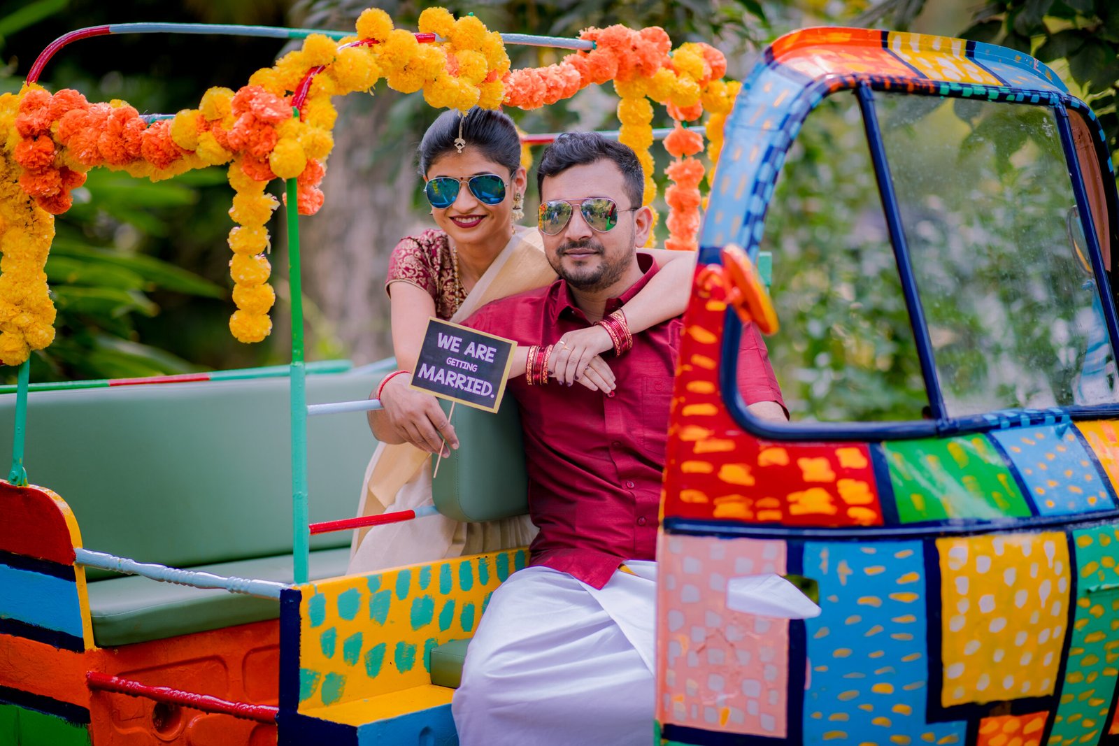 Couple riding a colourful scooter during a pre-wedding photoshoot